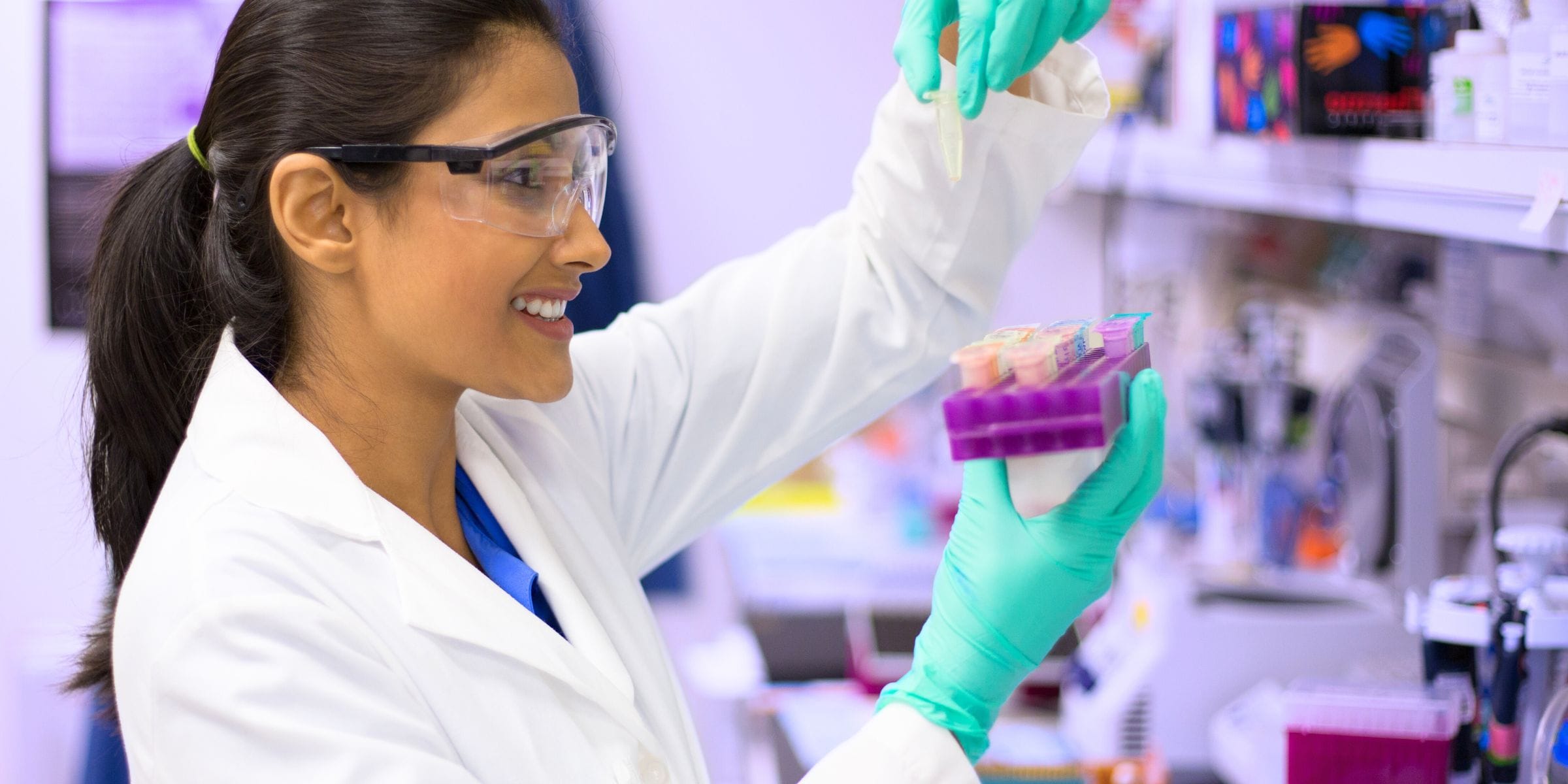 female scientist doing research in a laboratory for her own medical business