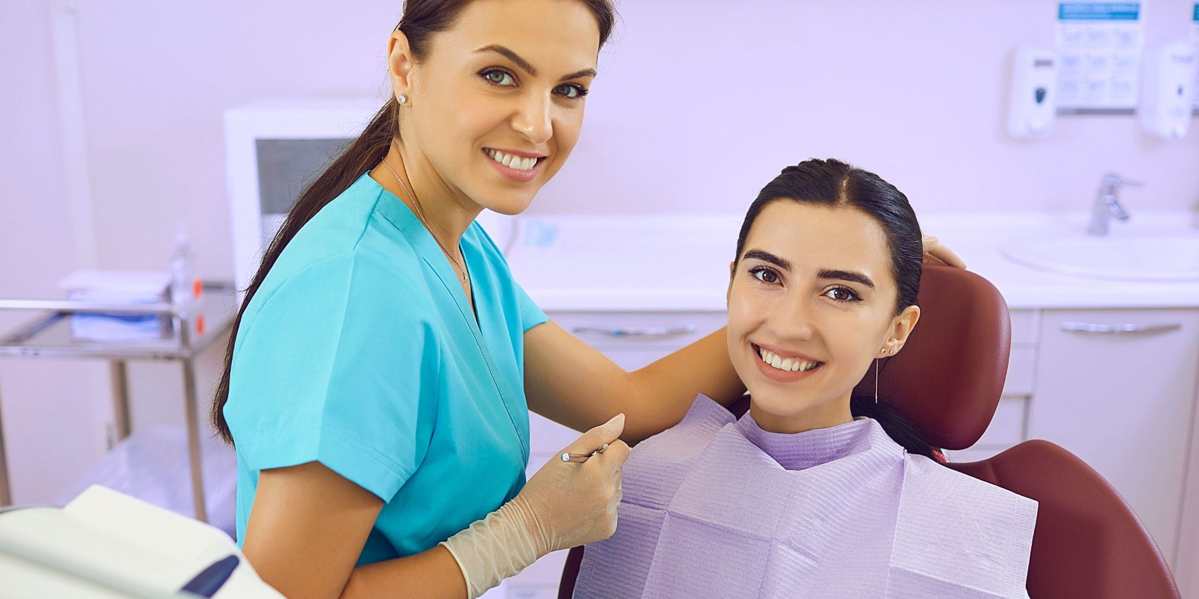 woman at the dentist getting professional dental cleaning and gum treatment