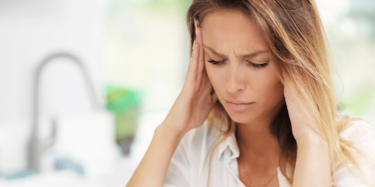woman with migraine headache needs sour diesel cbd flower