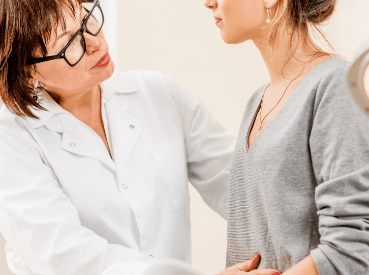 young woman with fibromyalgia talking with her doctor