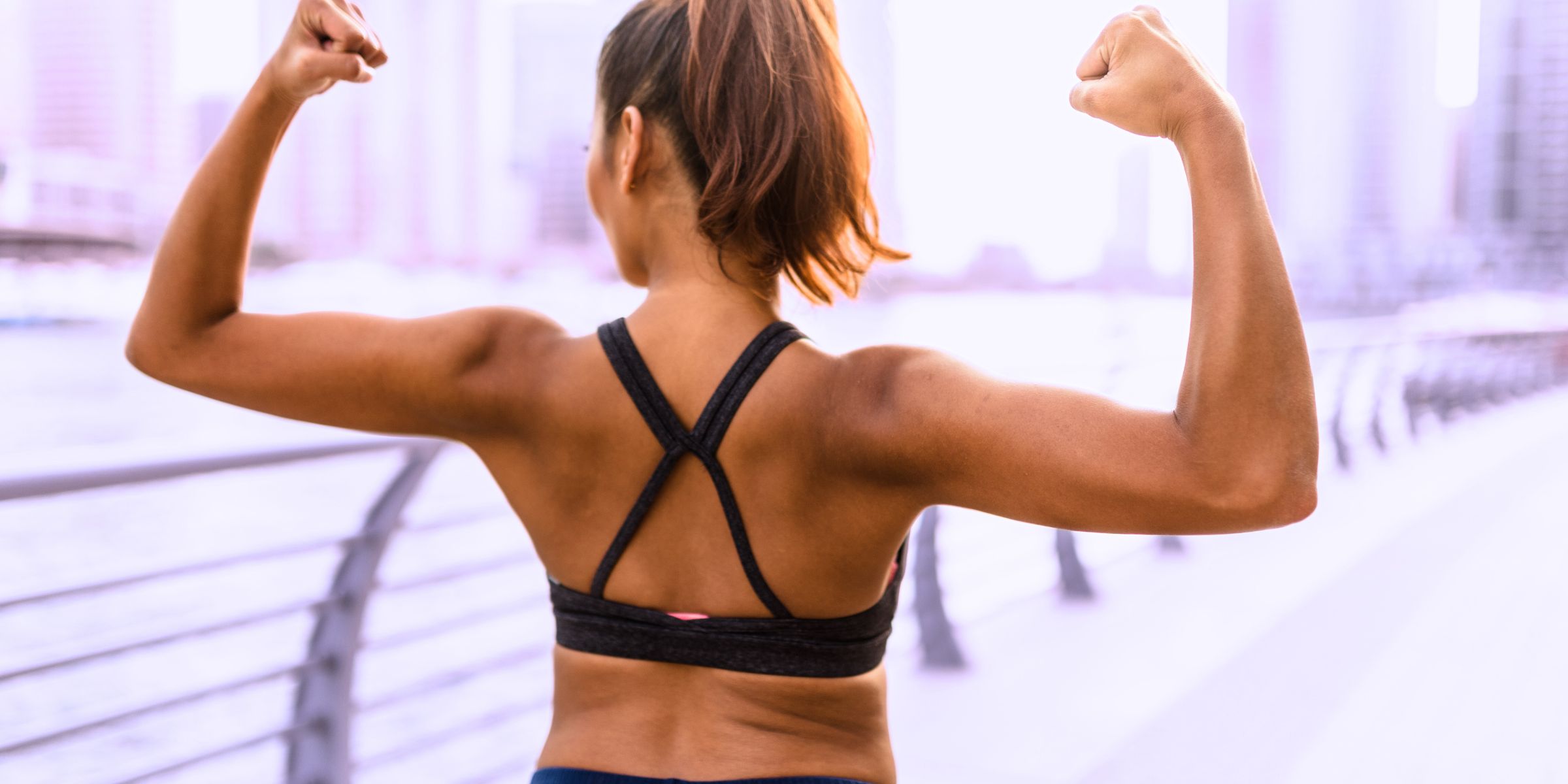 woman with muscle growth in back muscles from protein drinks