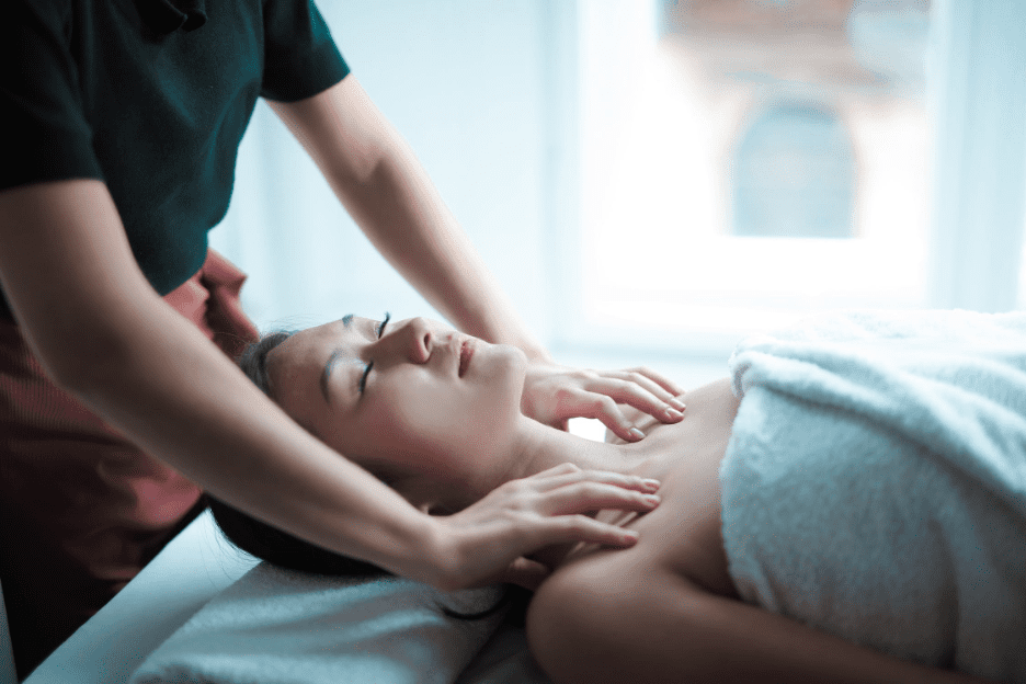chiropractor performs massage on woman with fibromyalgia